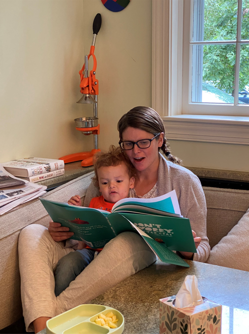 Kasie Hunt reading a book to her son Mars